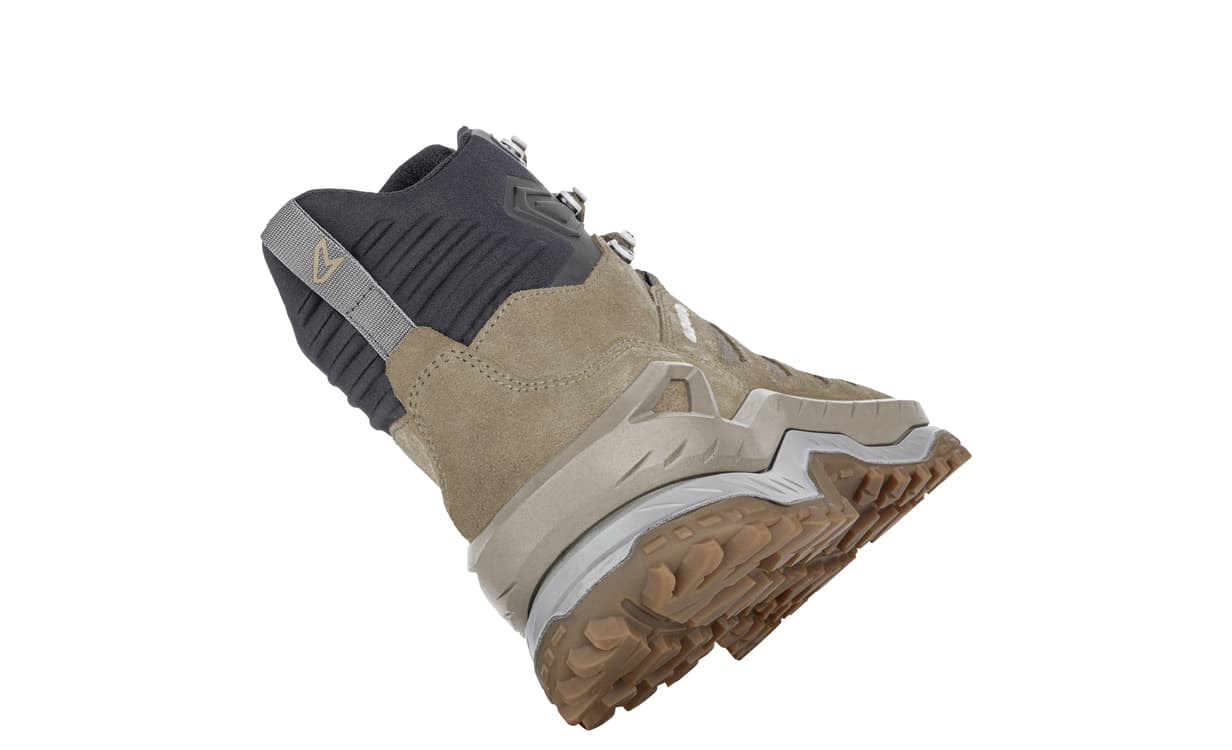back view of mid height tan hiking boot on white background