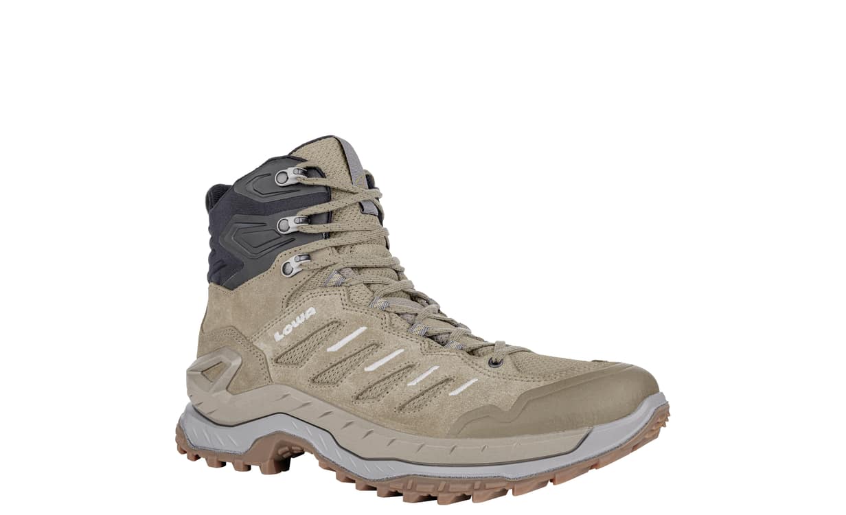 Mid height tan hiking boot on a white background