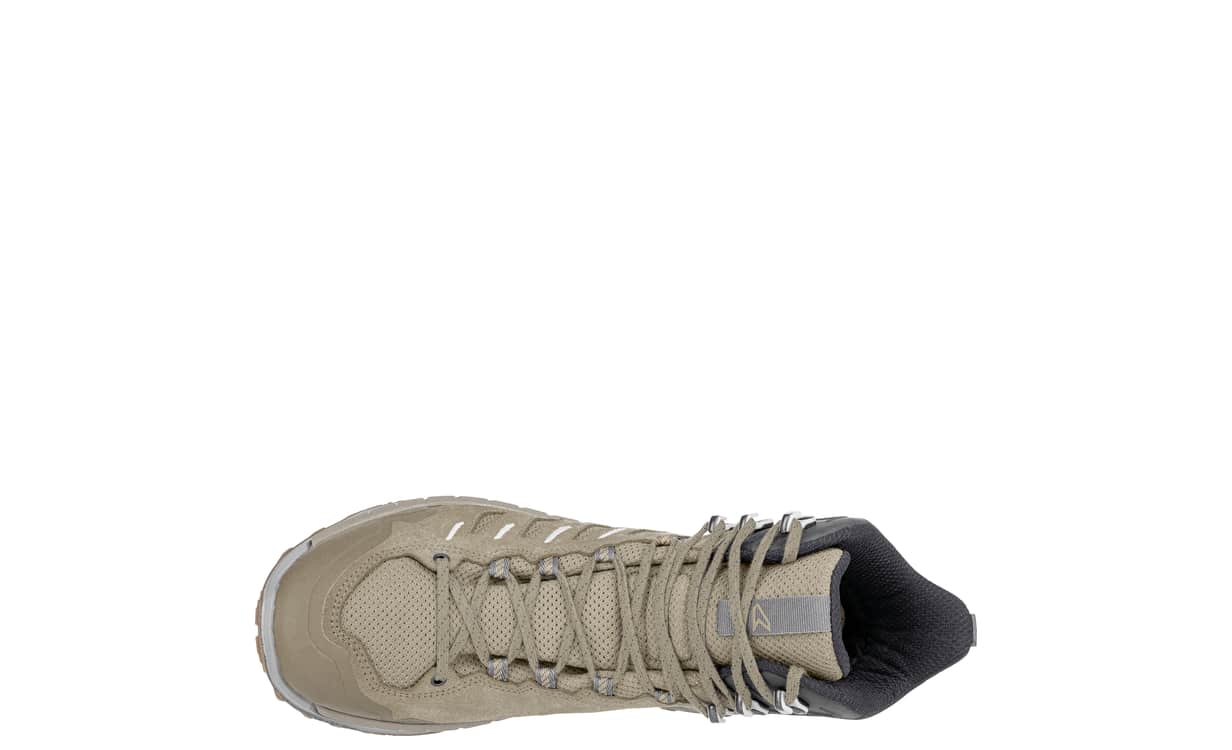 top view of mid height tan hiking boot on white background