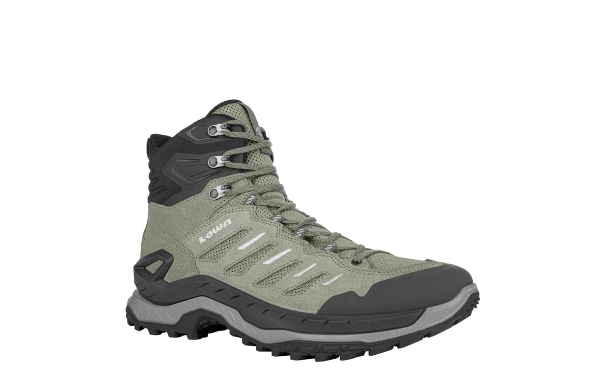 Mid height sage green hiking boot on white background