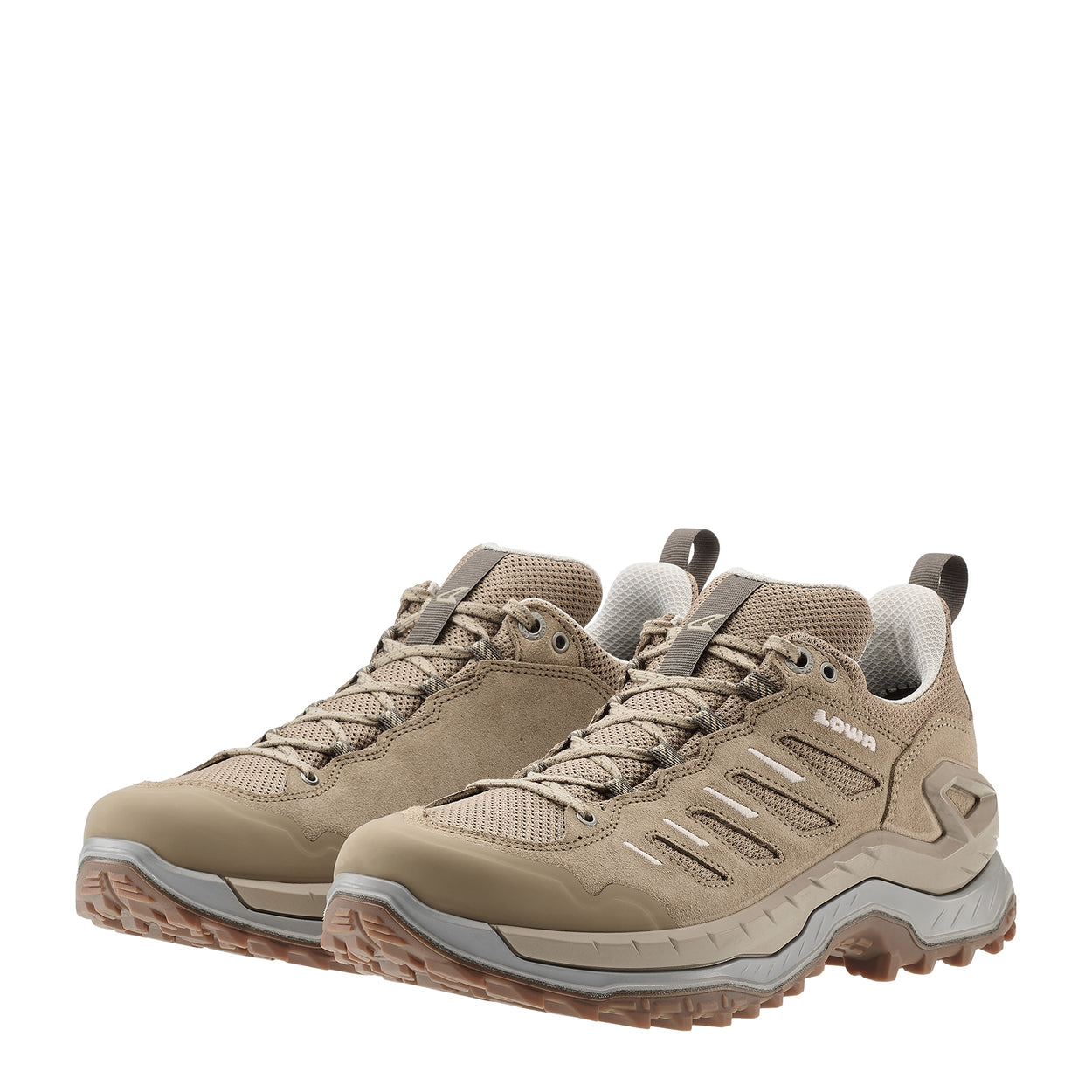Pair of beige hiking shoes on a white background