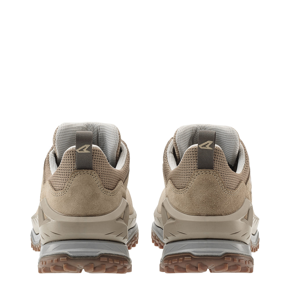 Pair of beige hiking shoes with visible brand logo on a white background