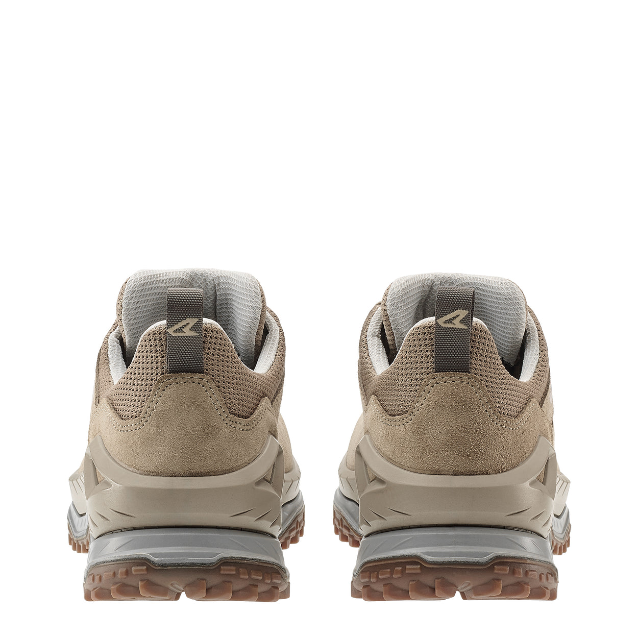 Pair of beige hiking shoes with visible brand logo on a white background