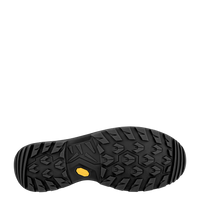 Close-up of a black shoe sole with a yellow dot on a white background